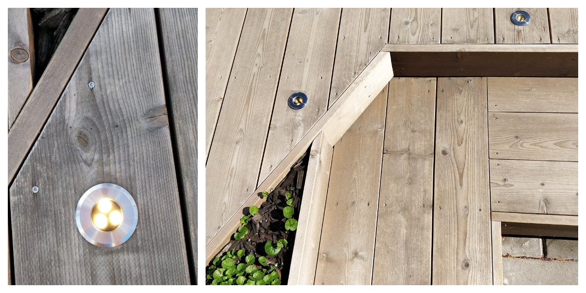 Lähikuva ja laajempi näkymä modernieista, pyöreistä LED-valaisimista tunnelmavalaistukseen. Valaisimet on ulkokäyttöön sopivaan puuassiin, ja terassin väleistä pilkottaa vihreitä kasveja. - LedStore Close-up of the TER-UP installed in wooden decking.