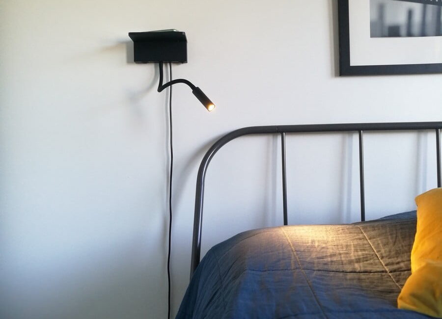 NIGHT night and reading lamp at the head of the bed. The light has both wireless charging and a USB slot for charging your phone.  Ledstore.fi