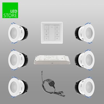 LED downlight kit with switch, controller, connectors on grey background; "LED Store" logo in upper left corner. Perfect for modern, energy-efficient lighting solutions.