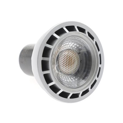 LED spotlight bulb GU10 base, white, QC PASS label visible. Ideal for energy efficient lighting solutions in modern spaces.