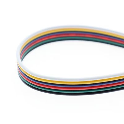 Close-up of a flat led strip cable with red, green, yellow, white and black wires; perfect for LED lighting connections.