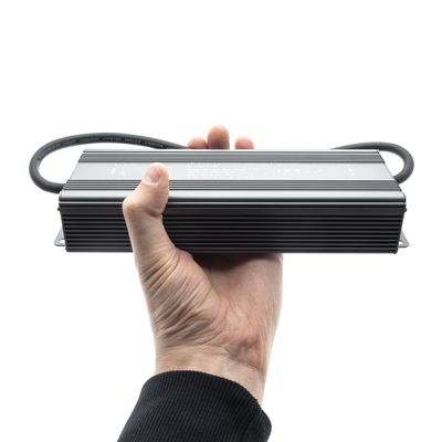 Handheld LED power supply with cables at both ends, ideal for energy efficient lighting solutions, with white background.