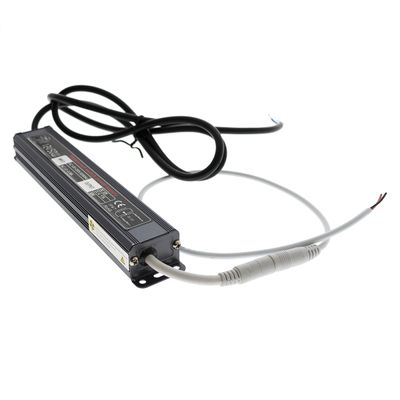 Rectangular LED power supply with black and white cables on a white background, designed for energy efficient lighting solutions.