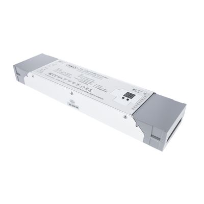 Close-up of a white and grey electronic device for LED luminaires with a label with technical data and symbols for optimal lighting performance.