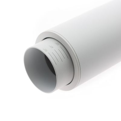 Close-up of an adjustable white cylindrical LED luminaire with a flat surface, ideal for contemporary home and commercial lighting solutions.