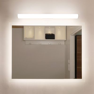 Wall mirror with LED edge lighting to reflect the door, shelves with hooks and arranged folded clothes and hangers.