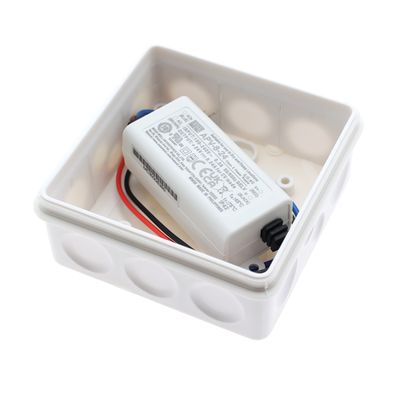 White rectangular electrical junction box with wiring and labelled electronic component for the installation of LED lighting.