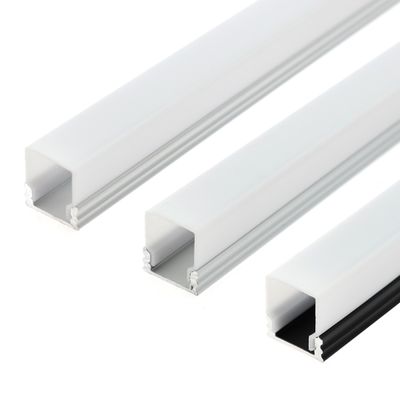 Close-up of three white rectangular aluminium extrusion with open channels, aligned parallel on a white background. Ideal for LED lighting solutions.