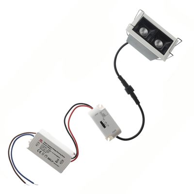 LED lighting components with wires, motion sensor and power supply, with white background for installation of electronic devices.