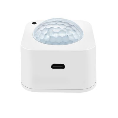 Textured dome-shaped sensor device with side port, ideal for LED lighting automation and smart home integration.