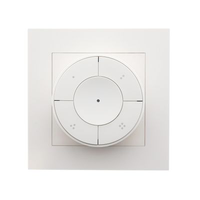 White rectangular light switch socket and round four-button remote control with white background - LED lighting controls.