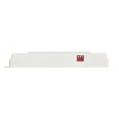 Close-up of a white rectangular LED lighting component with a small red switch; numbered labels indicate settings.