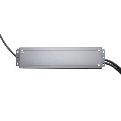 Rectangular grey LED power supply with cables at both ends, insulated with white background, for LED lighting solutions.
