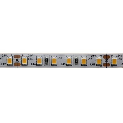 LED strip close-up with yellow and white LEDs, copper contacts and cross-sectional markings for lighting applications.