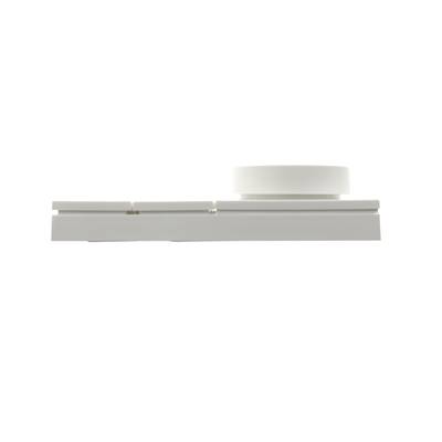 Side view of a modern white LED light fixture with a flat base and a round reflector, on a white background.