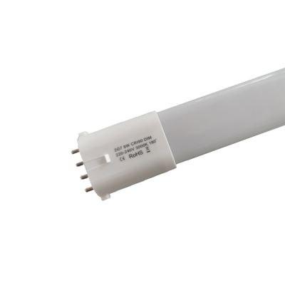 Close-up of LED tube luminaire base with metal studs and text lettering on the white part, perfect for energy efficient lighting.