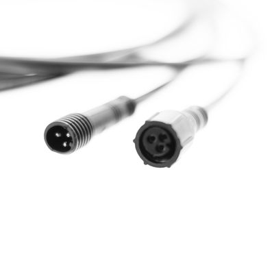 Close-up of two circular three-pole electrical connectors for LED lighting on a white background. Suitable for enhancing lighting systems.