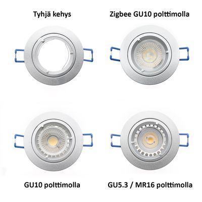 Four round ceiling luminaires with Zigbee GU10, standard GU10 and GU5.3/MR16 bulbs fitted; one luminaire is a blank frame with blue side clips.