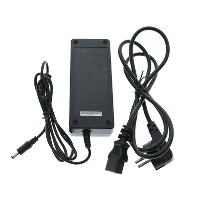 Black LED power adapter with two cables, plug and tip on a white background - essential for efficient energy efficient lighting systems.