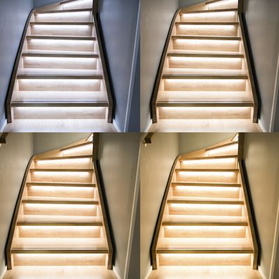 Wooden staircase with LED lights under each step, presented from different angles and lighting settings. Perfect for home decoration!