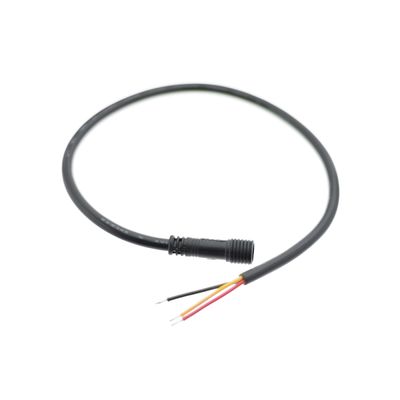 Close-up of black cable showing red, yellow and black wires for LED lighting installation.