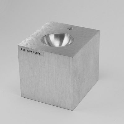 Modern metal wall mounted LED luminaire, minimalist design, conical recessed bracket, 2x3W, 3000K warm white.