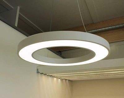 Modern round ceiling LED luminaire with sleek design, soft glow; perfect for adding contemporary style and energy efficient lighting.