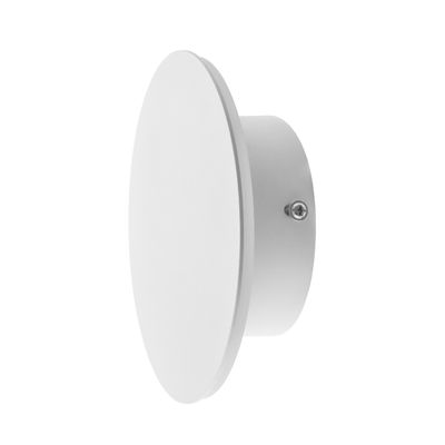 White round wall lamp with flat circular surface and cylindrical base, oblique view. Ideal for modern interiors and adds ambiance with LED lighting.