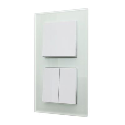 A contemporary white LED light switch panel with three switches mounted on a stylish glass panel.