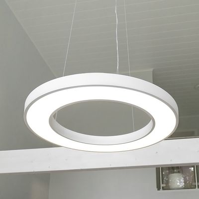A modern circular pendant LED luminaire that illuminates the ceiling of a minimalist room, showcasing elegant design and energy-efficient lighting solutions.