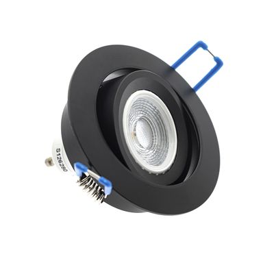 Black round flush mount LED downlight with spring clips and textured reflector for targeted light