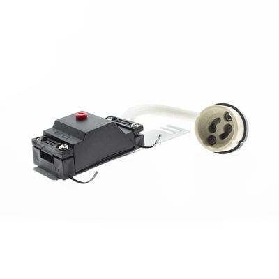 Black electrical appliance with red button in white round socket on cable, insulated with white. LED lighting accessory for efficient power management.