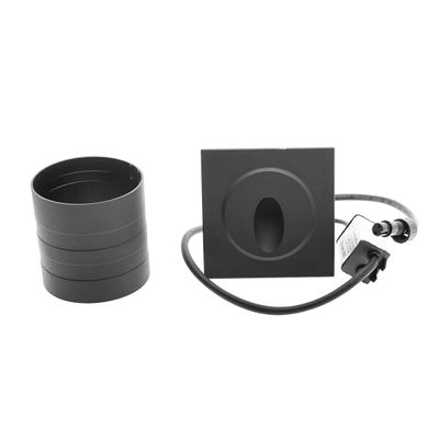 Square recessed ceiling light with cylindrical adapter and wiring on a plain white base - modern LED lighting.