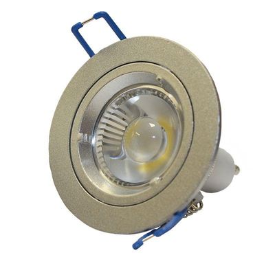 Close-up of a silver-coloured flush-mounted LED spotlight bulb with base and blue holders, ideal for energy-efficient lighting solutions.