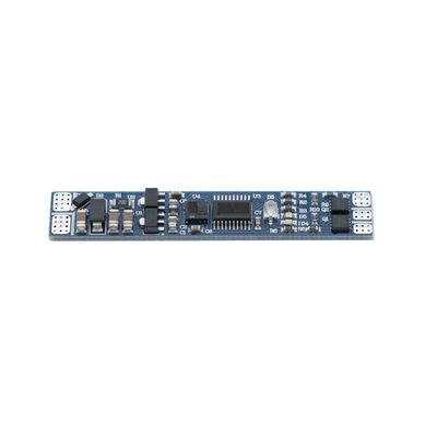Small blue electronic circuit board with resistors, capacitors and connectors on a white background | LED lighting components and accessories