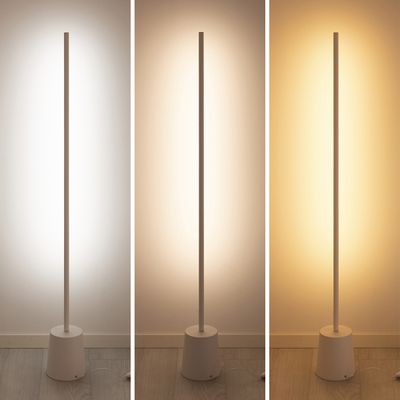 Modern floor lamps in a row bring cool white, neutral white and warm white light against a neutral wall and showcase the versatility of LED.