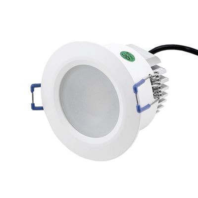 Round white recessed LED downlight, heat sink, blue mounting clips, black cable for ceiling lighting.