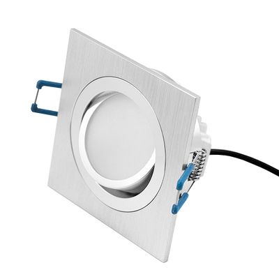 Square flush ceiling luminaire with round LED in the centre and blue side bracket, ideal for modern, energy efficient lighting solutions.