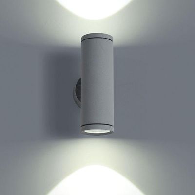 Modern cylindrical wall lamp with double light distribution and decorative wall pattern. Perfect for LED lighting.