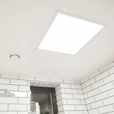 Bright LED panel luminaire mounted on a white tiled bathroom ceiling with window and fan, providing energy efficient lighting.