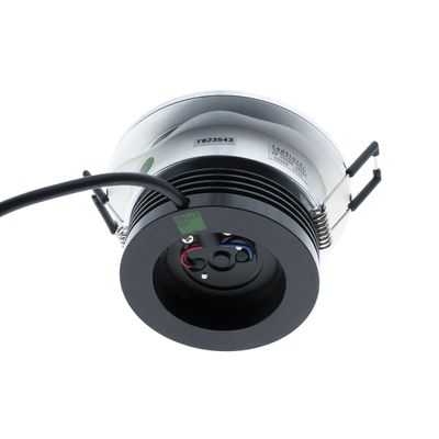 Close-up of a recessed LED ceiling light with black trim and wires, ideal for modern efficient lighting installation.