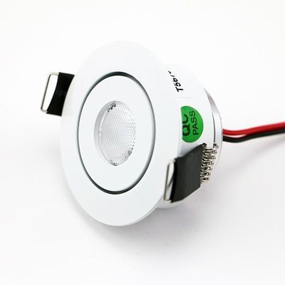 Alternative text: white round LED module with black holders, red and black wires attached - perfect for efficient lighting solutions.
