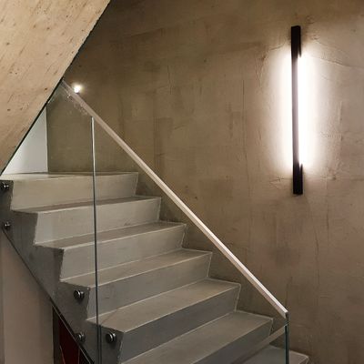 Line 900 wall light illuminated in a staircase.