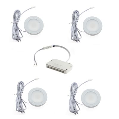 A set of four circular LED disc lights with cables connected to a central white power distribution hub for efficient lighting solutions.
