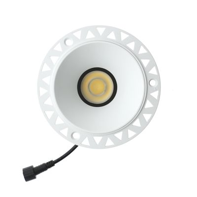 White recessed LED downlight with black rim and yellow centre with visible connector wire end for easy installation.
