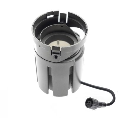 Grey outdoor LED luminaire with round design and black cable for energy efficient lighting.