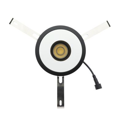 Round recessed LED ceiling light, black upholstery, white centre, metal arms, power cord with connector; perfect for modern lighting solutions.