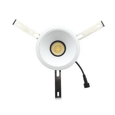 Circular LED downlight with metal mounting brackets and black cable visible on a white background. Ideal for contemporary lighting solutions.