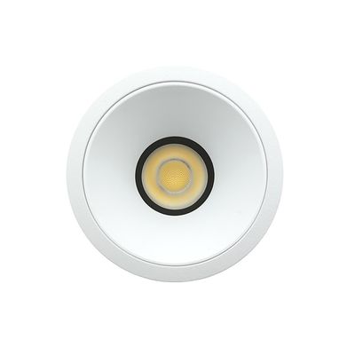 Close-up of a recessed ceiling LED light, circular design, glowing bulb; an energy efficient lighting solution for modern interiors.