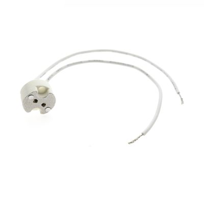 Ceramic electric lamp holder with two white wires, insulated on a white base - ideal for LED lighting solutions and installations.